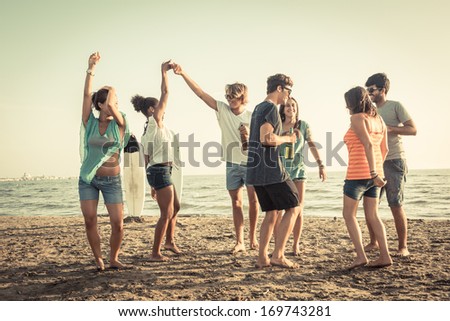Group of Friends Having a Party on the Beach
