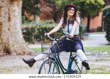 Old Fashioned Woman Riding Bicycle at Park