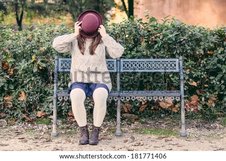 Old Fashioned Woman Hiding Behind Hat