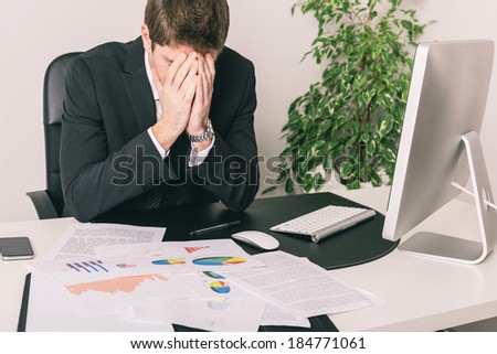 Stressed Young Businessman at Office