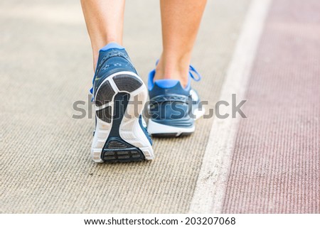 Woman Ready to Run on Track Lane