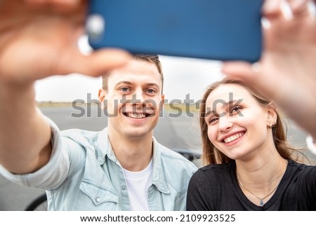 Happy couple taking a selfie together and smiling at camera - Caucasian man and woman, best friends, sharing time together and laughing - Friendship and happiness lifestyle concepts ストックフォト © 