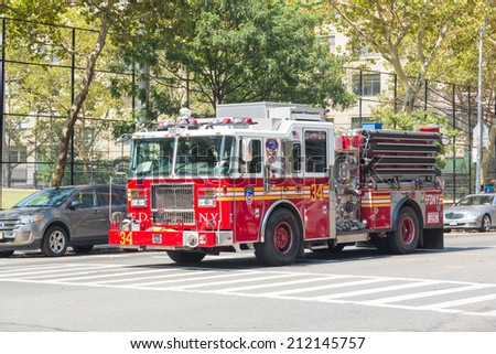 NEW YORK, USA - AUGUST 20, 2014: FDNY fire truck on Manhattan 9th Avenue. FDNY provide both Fire and EMS services.
