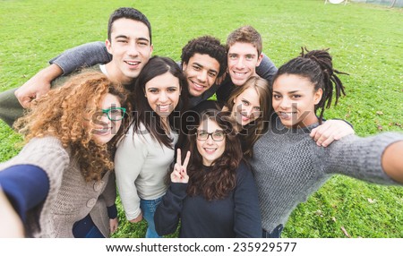 Similar – Image, Stock Photo Cheerful black friends taking selfie in city