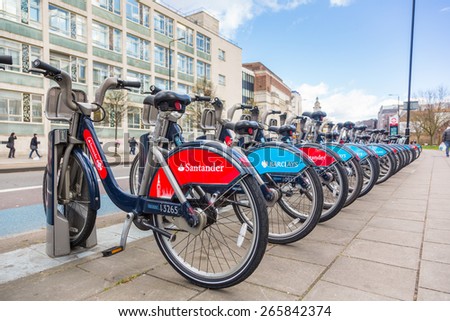 LONDON, UK - MARCH 31, 2015: Cycle hire docking station with new bikes sponsored by Santander who replaced Barclays as main sponsor.