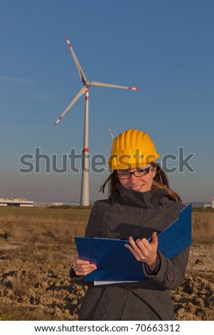 Female Technician Engineers in Wind Turbine Power Generator Station
