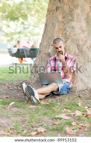 Young Man With Computer at Park