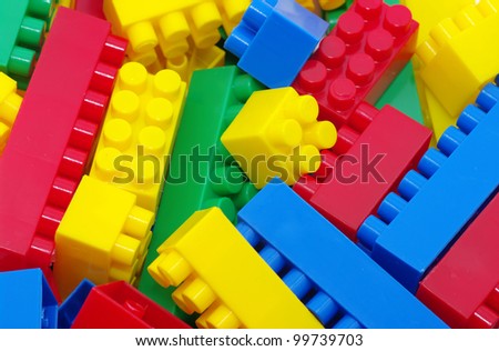 toy background made with color plastic bricks