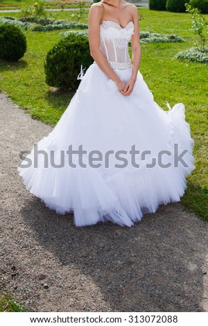 Beautiful bride in wedding dress preparing to ceremony in church