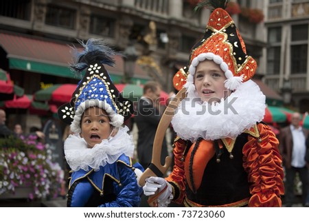 BRUSSELS, BELGIUM, SEPTEMBER 2010: Two unknown children at unknown age acting on the 50th ANNIVERSARY OF THE FOUNDATION OF THE ILOT SACRE. Grande Place, Brussels, Belgium, September 10, 2010.