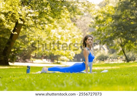 Similar – Image, Stock Photo Flexible young sportswoman practicing yoga on street