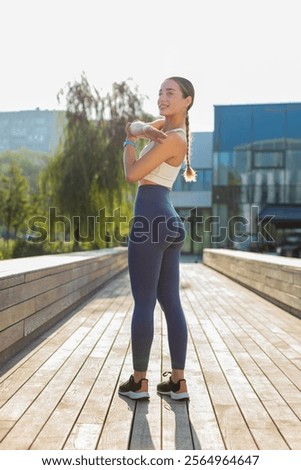 Similar – Foto Bild Flexible Sportlerin streckt Körper auf sonnigen Tal