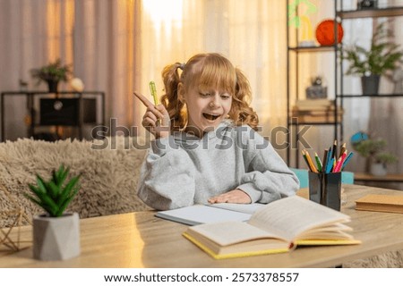 Similar – Image, Stock Photo Concentrated and enthusiastic girl plays table hockey.