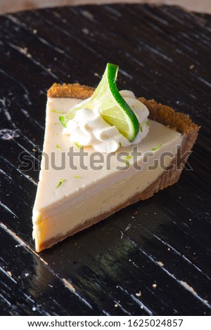 Similar – Image, Stock Photo Sliced lemon pie on blue background. Fruit tart slices