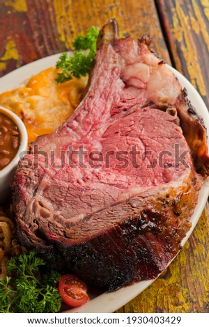 Prime Rib. Beef Prime Rib bbq. Beef rubbed in spices and seasoning and slow cooked in a smoke house with mesquite wood chips. Traditional barbecue Texas Smoke House beef prime rib.  ストックフォト © 