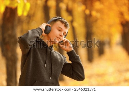 Similar – Image, Stock Photo Teenagers stand with closed eyes in front of a bright wooden wall and enjoy the wind in their hair.