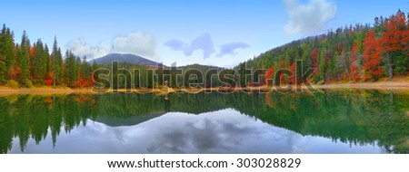 picturesque lake in the autumn forest. Mirror reflection