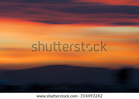Spectacular sunset colors. Image is blurred by intentional camera movement during exposure. Useful as backgrounds and backdrops.