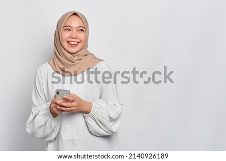 Similar – Image, Stock Photo Charming Arab woman in hijab looking at camera