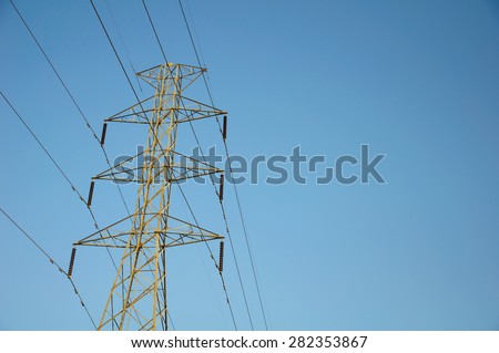 Electricity Pylons on blue sky