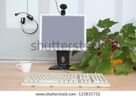 Computer's monitor and  keyboard on the office table