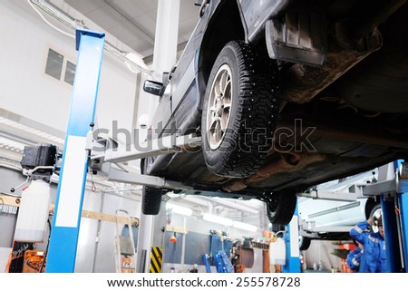 The car on the lift prepared to repair