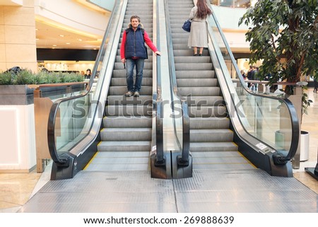 The man on the escalator at the mall