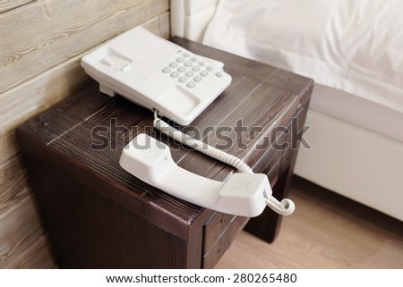 Phone with the hanging tube in hotel room