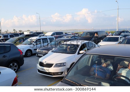 Russia, Caucasus Port, July, 14, 2015: hundreds of cars gathered in turn on a ferry through the Strait of Kerch from the Russian Port Caucasus to the Crimea. Expectation lasts for many hours