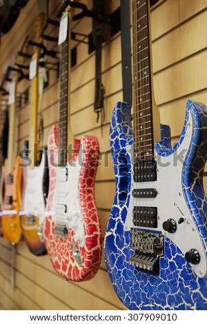 The image of guitars on a show-window of musical shop