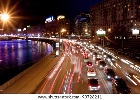 The image of night traffic jam on city embankment in Moscow