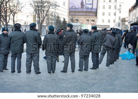 MOSCOW - MARCH 10: Police cordon on a participants of the protest manifestation against falsification of the president election, Noviy Arbat in Moscow. March, 10, 2012 in Moscow