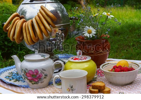Russian tea party with samovar in the garden
