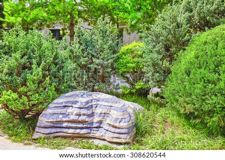 Typical Chinese garden,  park with bizarre rocks. Beijing, China