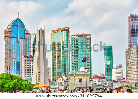 SHANGHAI, CHINA - MAY 22, 2015: The people, the citizens of Shanghai, modern office and residential buildings on the streets of Shanghai, transport and ordinary urban life of the city.