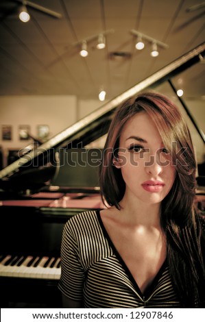 Young female model in a piano store.