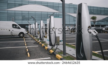 Similar – Foto Bild Elektrofahrzeug-Ladestation Schild Auto auf der Straße