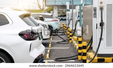 Similar – Foto Bild Elektrofahrzeug-Ladestation Schild Auto auf der Straße