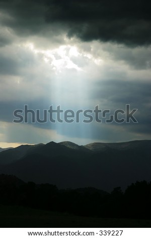 light streaming through clouds after rainstorm