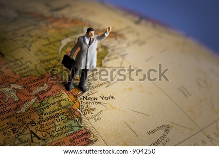 Business travel figure on globe highlighting New York