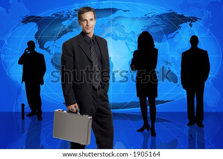 Businessman with briefcase standing in front of an earth map and other business people in silhouette