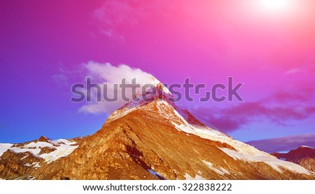 Snow capped mountains.  Top of the mount. View of the  Matterhorn mount at the sunrise.