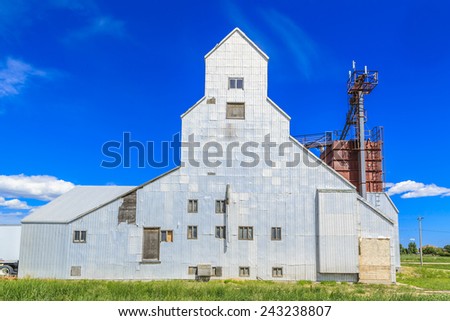 An old grain elevator has been converted into a seed farm.  Farmers grow seeds for sale or for farm use.