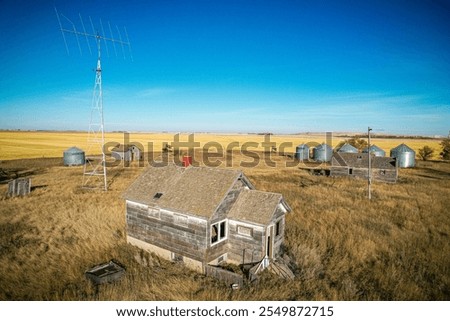 Similar – Image, Stock Photo A few wooden huts and many bushes and trees are standing around on a hilly green meadow landscape in the nature park Ammergau Alps in Upper Bavaria and a piece of bicycle path can be seen as well.