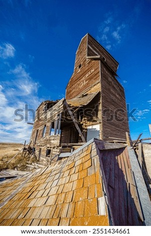 Similar – Image, Stock Photo Dilapidated old buildings in mountain desert under cloudy sky