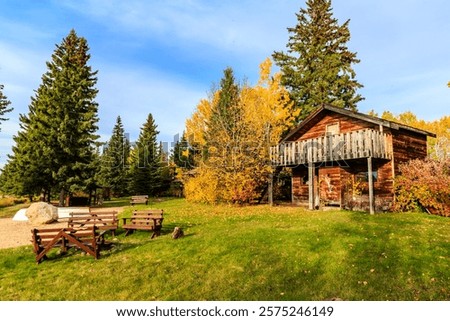 Similar – Image, Stock Photo A few wooden huts and many bushes and trees are standing around on a hilly green meadow landscape in the nature park Ammergau Alps in Upper Bavaria and a piece of bicycle path can be seen as well.