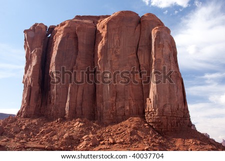 Monument Valley is considered one of the natural wonders of the world because of the beauty of the enormous \
