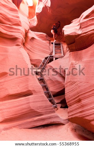 PAGE, AZ - SEPT 13:   Person climbing down the ladders inside Lower Antelope Canyon. Some of the access is via sheer drops. Sept 13, 2010 near Page, Arizona.