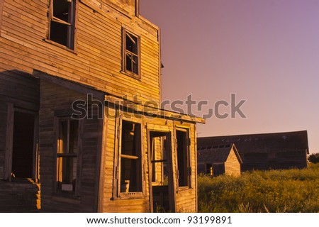 An old-fashioned vintage general store in a ghost town at sunset
