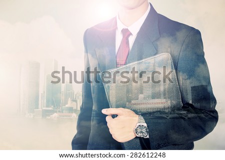 Conceptual image of urban lifestyle. Double exposure of business man body in suit and modern city horizon
